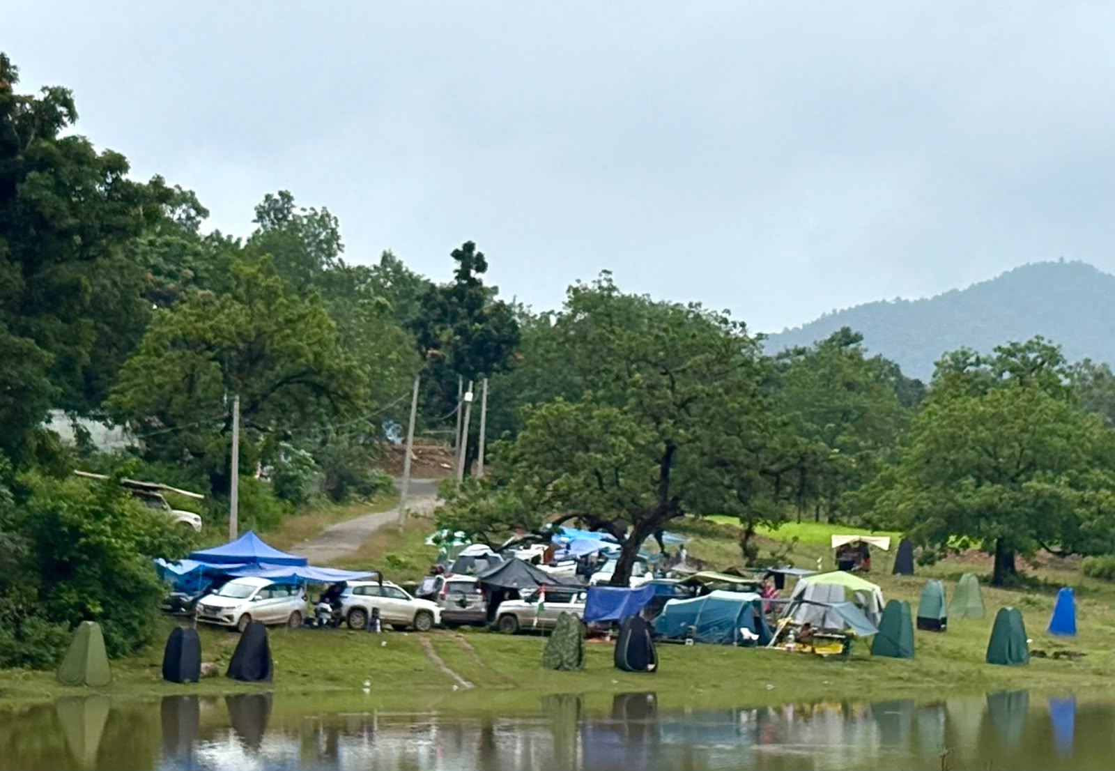Community camping beside a lake
